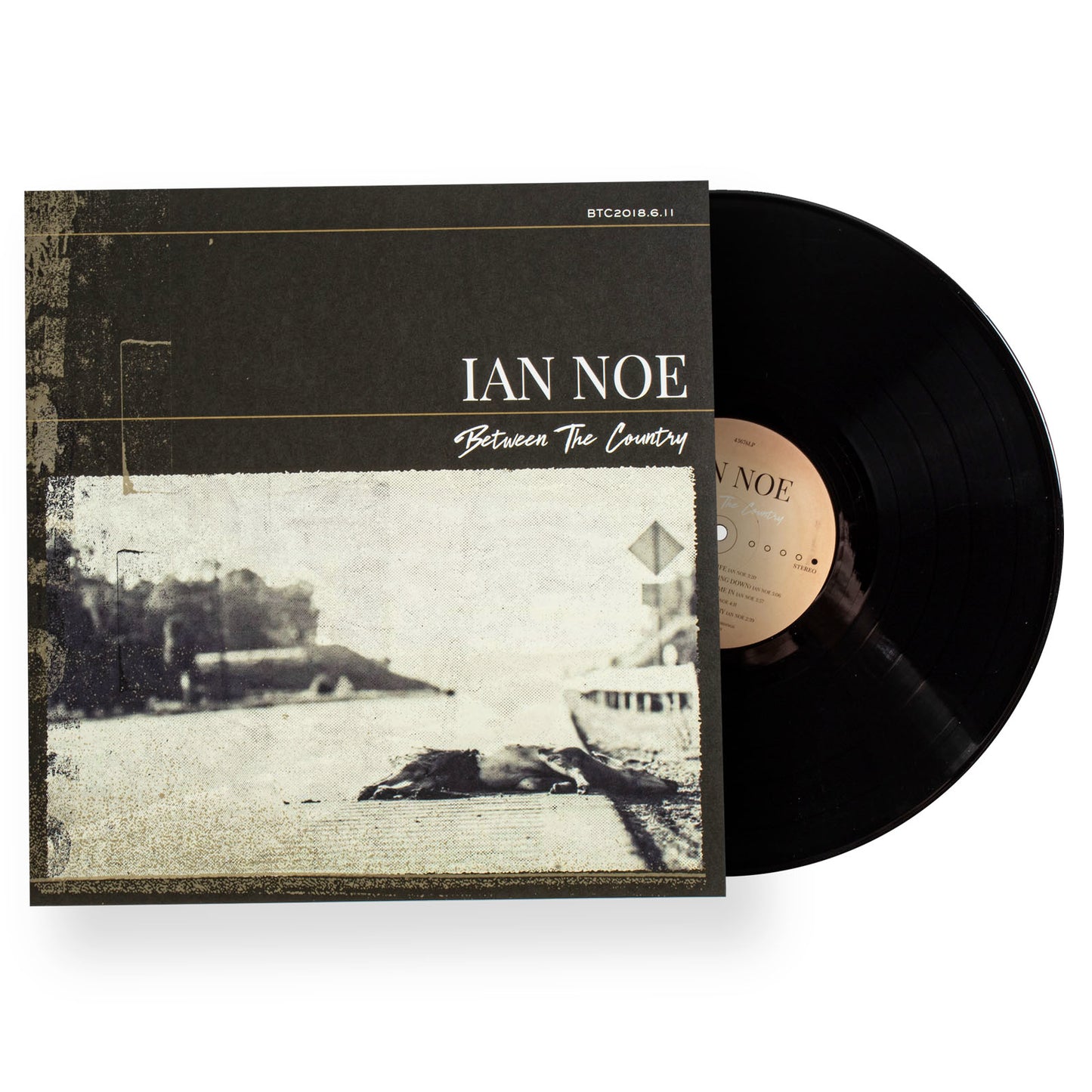 Vinyl record with cover featuring 'Ian Noe' and 'Between The Country' on a white background