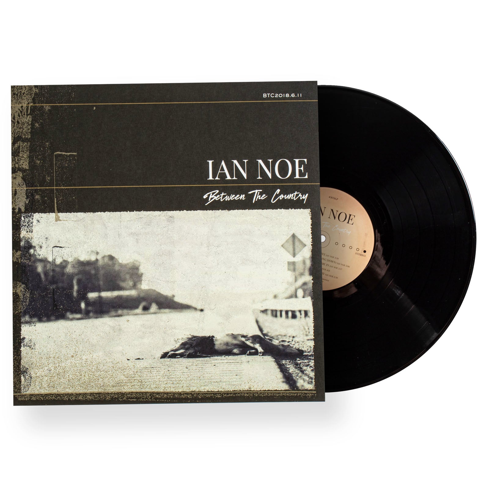 Vinyl record with cover featuring 'Ian Noe' and 'Between The Country' on a white background